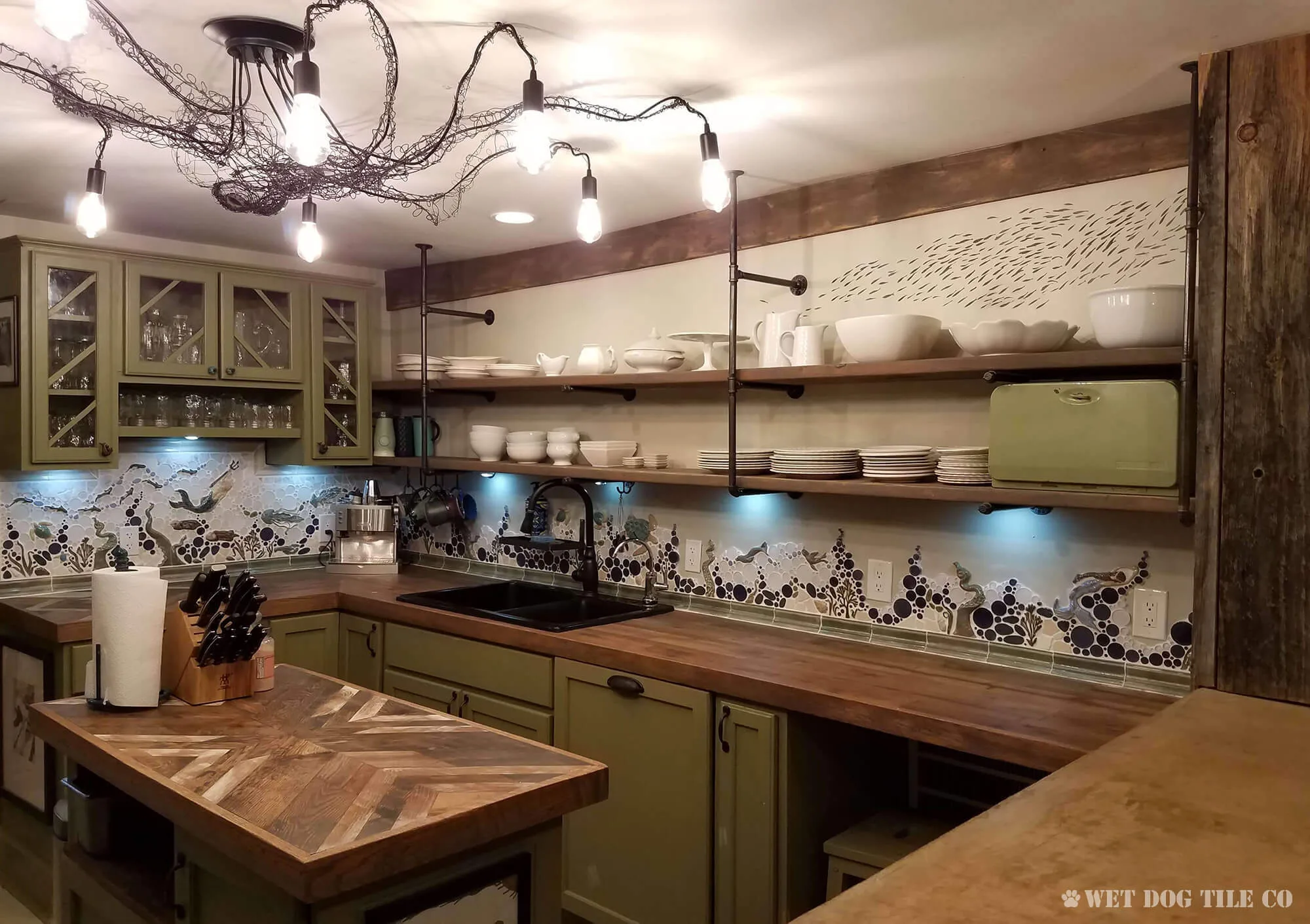 eclectic kitchen mosaic backsplash mural with tentacles, mermaids, turtles, jellyfish, and otters