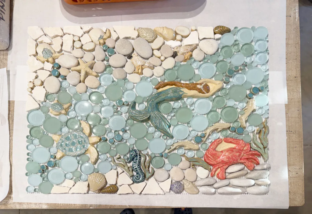 mermaid themed mosaic tile mural being made