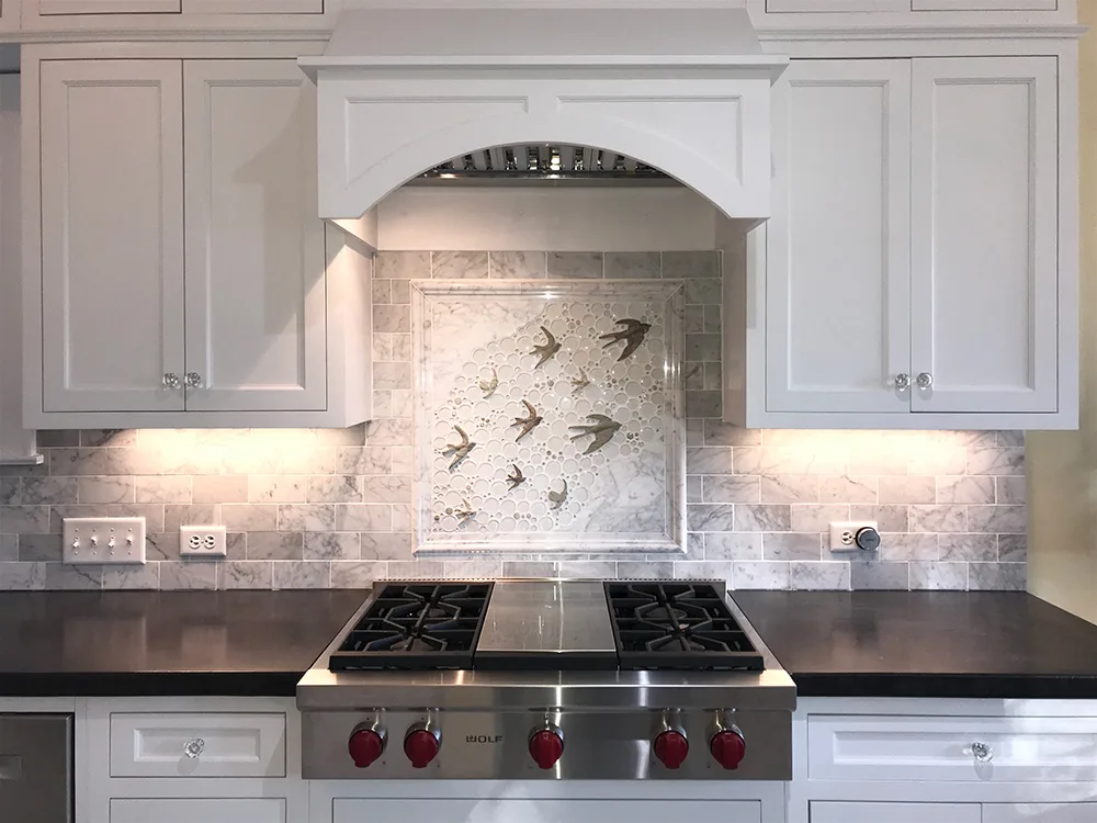 Kitchen cooktop backsplash mural with white carrara marble