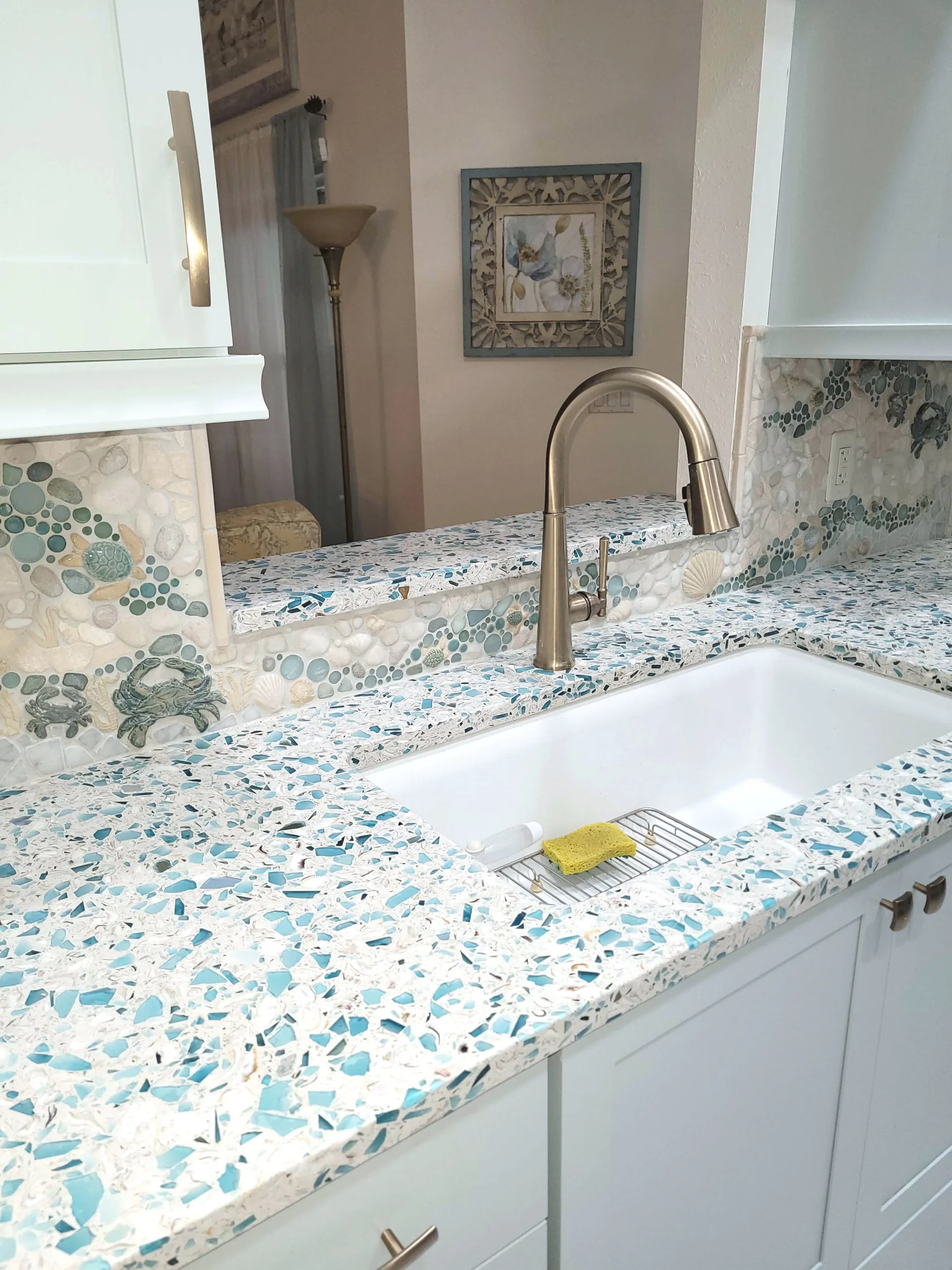 Custom kitchen mosaic tile backsplash with crabs, turtles, starfish, and more